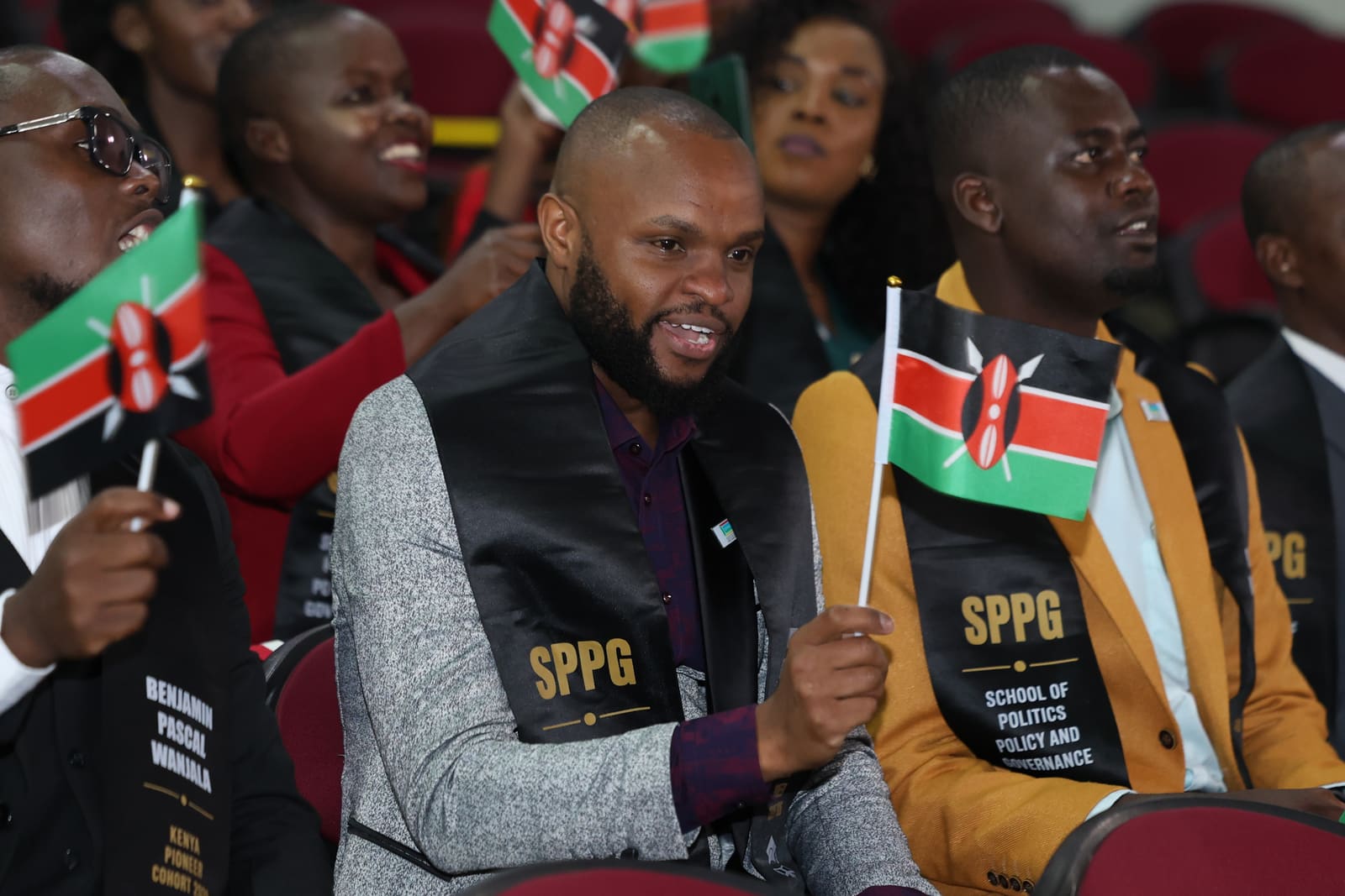 SPPG Kenya students seated with Kenyan flags